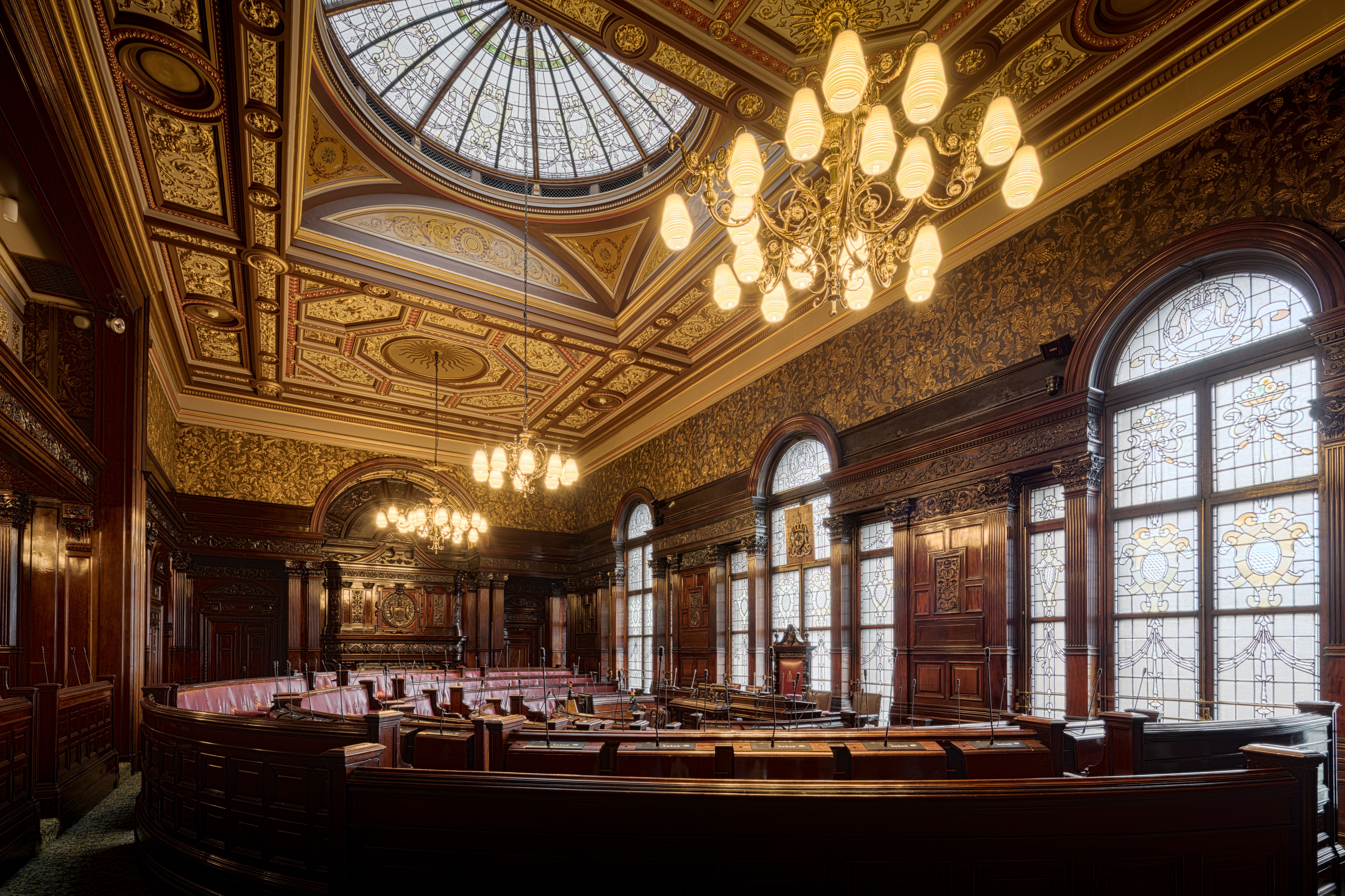 Ornate courtroom chamber with a domed skylight